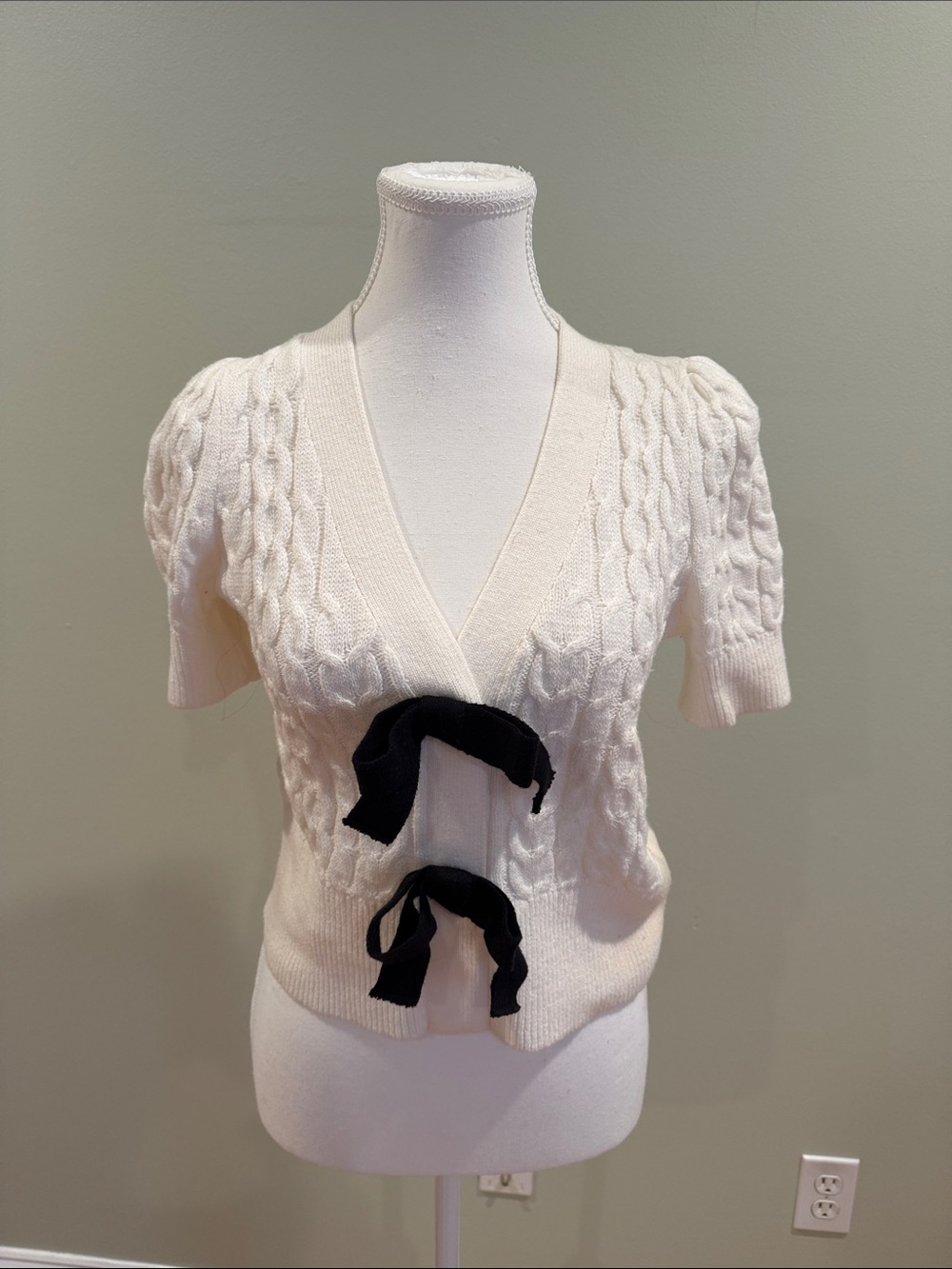 Express Cream Cable-Knit V-Neck Sweater with Black Bows